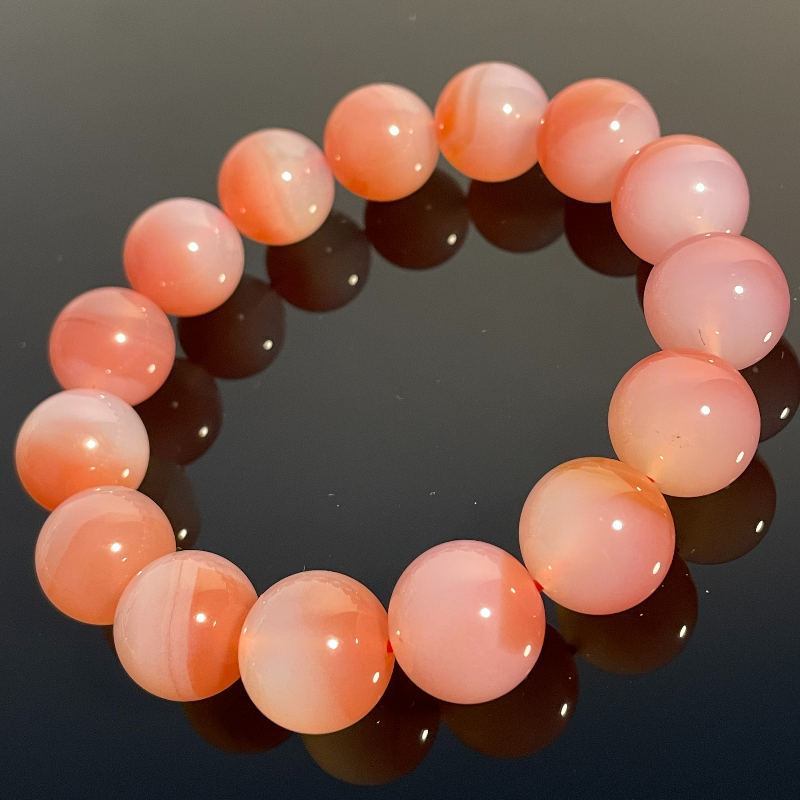 Peach Pink Crystal - Attracts wealth, calms the mind, love